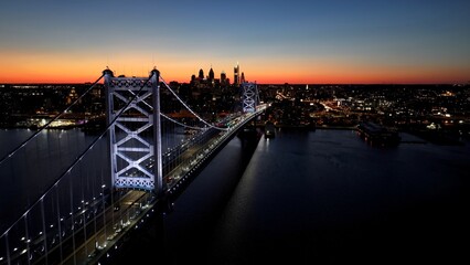 Sunset Ben Franklin Bridge In Philadelphia Pennsylvania United States. Stunning Landscape Of Highway Road Viewed From Above. Building Metropolitan High Rise Building Amazing.