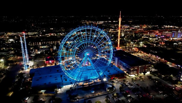 Ferris Wheel In Orlando Florida United States. Aerial View Of Exciting Amusement Park Perfect For Family Fun. Building Metropole Skyline Buildings Beautiful. Buildings Flyover Night. Orlando Florida.