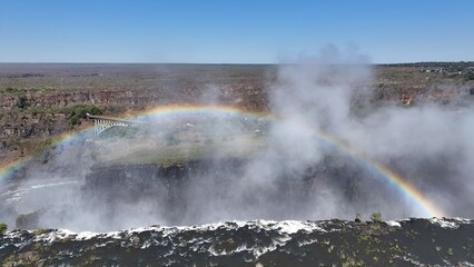 Colorful Rainbow In Livingstone Northern Rhodesia Zambia. Stunning Waterfalls Flowing In Natural Wonder Landscape. Recreation Falls Flowing Water High Definition. Canyon Flowing Water Nature.