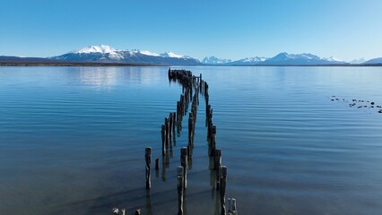 Coast City In Puerto Natales Magallanes Region Chile. Bustling Downtown Cityscape With Modern Buildings. Outdoor Travel Destinations Patagonia Glacier. Snow Covered High Angle View.