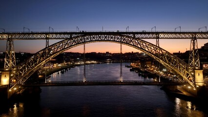 Obraz premium Dom Luis I Bridge In Porto Portugal. Stunning Railway Station In Downtown Cityscape Scene. Sunset Sky Clouds Downtown Cityscape. Sunset Downtown Illumination. Porto Portugal.