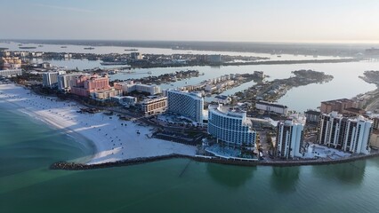 Fototapeta premium Clearwater Beach In Clearwater Florida United States. Aerial View Of A Bustling City With High-Rise Buildings And Traffic. Sunset Coast Sky City Seaside. Coast City. Clearwater Florida.