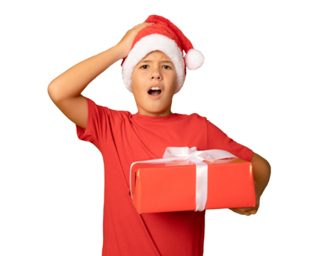 Surprised child boy in Santa Claus hat holding Christmas gift in hand. Christmas concept. PNG. - Powered by Adobe