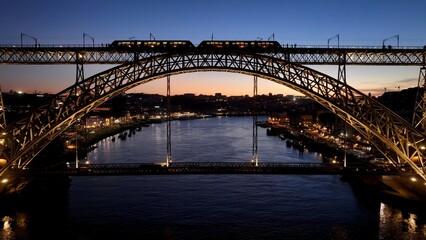 Luis I Bridge In Porto Portugal. Birds Eye View Of Suspension Bridge With Cars Driving Across. Building Industry Skyline Birds View Vibrant. Sunset. Porto Portugal.
