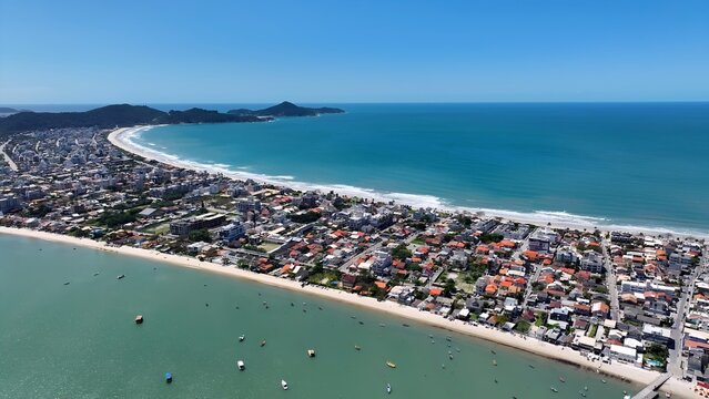 Mariscal Beach In Bombinhas Santa Catarina Brazil. Breathtaking Aerial View Of A Lush Tropical Coastline Scenery. Shore Sky Clouds Beach Sea. Outdoor Beach Panning Wide. Bombinhas Santa Catarina.