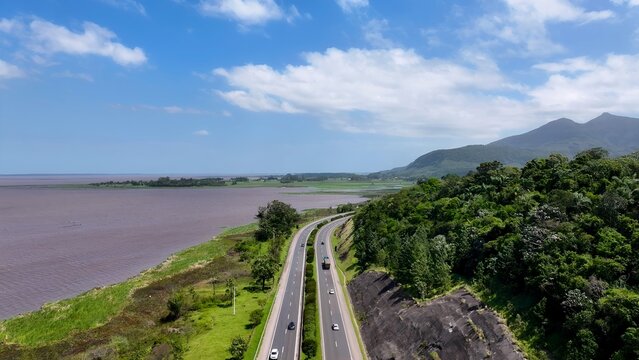 Br 101 Highway In Tres Cachoeiras Rio Grande Do Sul Brazil. Highway Interchange Crossing City With Traffic Jam. Countryside Sky Rural Field. Sky Panning Wide. Tres Cachoeiras Rio Grande do Sul.
