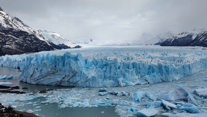 Los Glaciares National Park In El Calafate Santa Cruz Argentina. Birds Eye View Of Famous Glacier In A Patagonia Landscape. Snowflakes Tourism Glacial Landscape Blizzard.