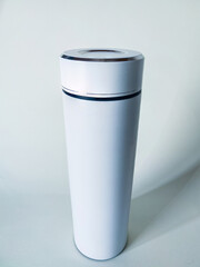 Matte White Thermos with Chrome Accents - 45° Top View for E-commerce & Ads, Natural Light Product...