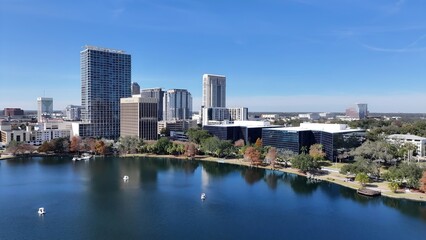 Fototapeta premium Orlando Skyline In Orlando Florida United States. Aerial View Of Green Space Surrounded By Lush Forest Trees. Town Sky Backgrounds Urban. Outside Backgrounds Up Above. Orlando Florida.