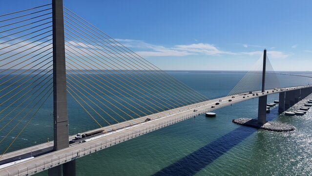 Sunshine Skyway Bridge In Saint Petersburg Florida United States. Breathtaking Aerial View Of Busy Traffic In A Freeway Road. Coast Horizon Seaside Summertime. Coast Panoramic.