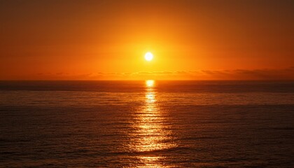 Fototapeta premium glowing sun rising over a calm sea in warm amber and burnt orange tones