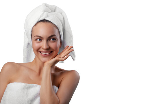 Smiling young woman wrapped in a white towel with a towel turban on her head. PNG with transparency