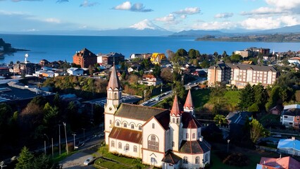 Osorno Volcano In Puerto Varas Los Lagos Chile. Snow-Capped Volcano Releasing Plumes Of Smoke Into Blue Sky. Snowing Day Lake Swiss Alps Snow Mountain. Snowing Day Nature. Puerto Varas Los Lagos.