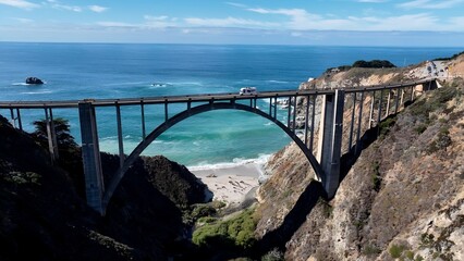 Bixby Creek Bridge In Highway 1 California United States. Cars Driving Towards Downtown City On The Famous Bridge. Shore Horizon Beach Sea. Outdoors Beach Panorama. Highway 1 California.