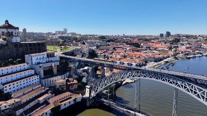 Fototapeta premium Luis I Bridge In Porto Portugal. Traffic Is Moving Across A Modern Cable-Stayed Bridge. Business Sky Clouds Downtown Cityscape. Outdoor Downtown Panning Wide. Porto Portugal.