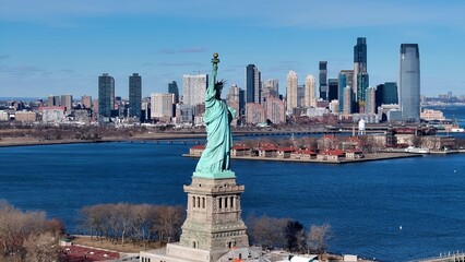 Statue Of Liberty In Manhattan New York United States. Aerial Landscape Of Famous Statue In A Natural Scenery. Business Clouds Sky Downtown Cityscape. Backgrounds Panoramic. Manhattan New York. © bydronevideos