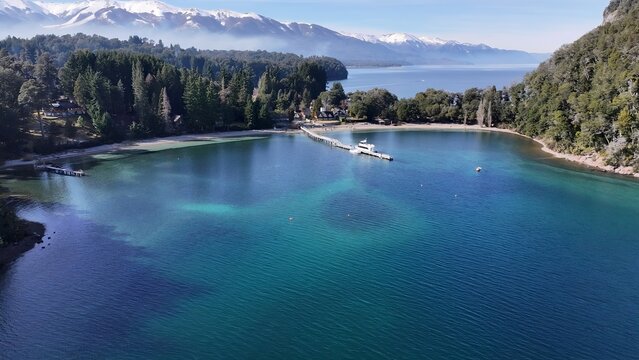 Brava Bay In Villa La Angostura Neuquen Argentina. Aerial View Of A River Surrounded By Lush Green Tropical Rainforest. Snowy Lake Patagonia Landscape Exploring. Patagonia Landscape.