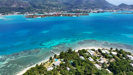 Obraz premium Seychelles Archipelago In Mahe Island Victoria Seychelles. Stunning Tropical Coastline Beach Scene Viewed From Above. Shore Sky Clouds Beach Sea. Outdoor Beach Panning Wide. Mahe Island Victoria.