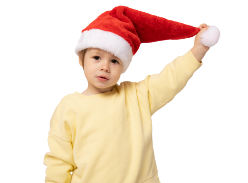 Cute little boy wearing santa Claus hat over transparent background. PNG.