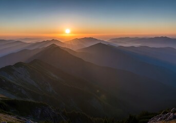 Majestic mountain range bathed in golden sunrise light