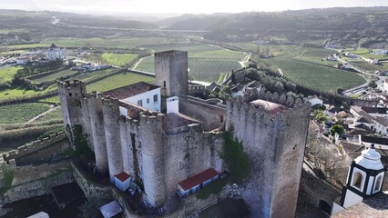 Obidos Castle In Obidos District Of Leiria Portugal. Medieval Building In A Bustling City Viewed...