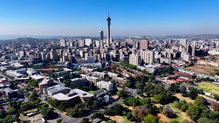 Johannesburg Skyline In Johannesburg Gauteng South Africa. Aerial View Of A High-Rise Buildings And Traffic Showcasing Urban Life. Business Clouds Sky Downtown Cityscape. © bydronevideos