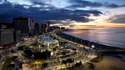 Naklejka premium Sunset Beach In Fortaleza Ceara Brazil. Bird Eye View Of A Amazing Coastal Beach In The Summer Holiday. Building Industry Skyline Birds View Vibrant. Sunset. Fortaleza Ceara.