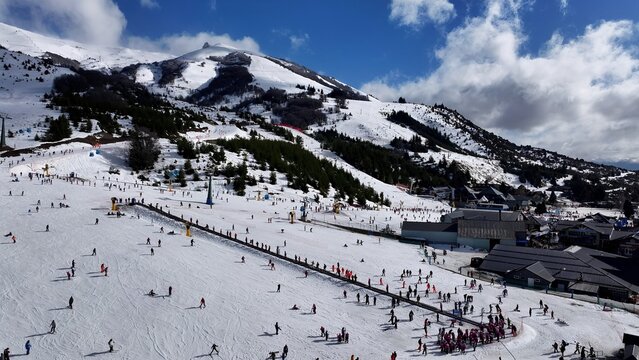 Cerro Catedral In Bariloche Rio Negro Argentina. Chair Lift Transporting Skiers And Snowboarders. Outdoor Tourism Icon Patagonia Glacier. Snow Covered High Angle View. Bariloche Rio Negro.