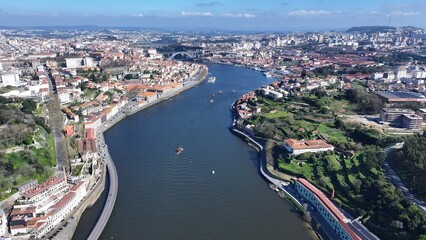 Fototapeta premium Porto Skyline In Porto Portugal. Aerial View Of A Bustling Downtown Cityscape With Modern Buildings. Town Sky Clouds Backgrounds Urban. Town Panorama. Porto Portugal.