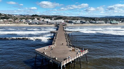 Pismo Beach Pier In Pismo Beach California United States. Turquoise Ocean Waves Gently Crashing On Tropical Beach. Coast Horizon Seaside Summertime. Seaside Beach Panning Wide.