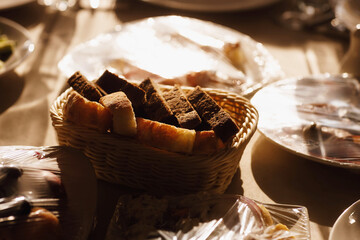 sliced white and black bread in a basket