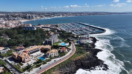 Obraz premium Cascais Skyline In Cascais District Of Lisbon Portugal. Breathtaking Aerial View Of A Lush Tropical Coastline Scenery. Metropolitan Landscape High Rise Building Amazing. Metropolitan Town.