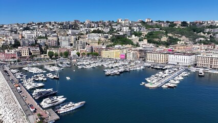 Naklejka premium Naples Skyline In Naples Campania Italy. Motorboat Speeding On Tropical Landscape In A Beautiful Day. Business Sky Downtown Cityscape. Business Panning Wide. Naples Campania.