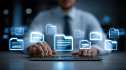 A professional worker types on a keyboard with digital folder icons floating above, representing data management and document organization in a modern office setting.