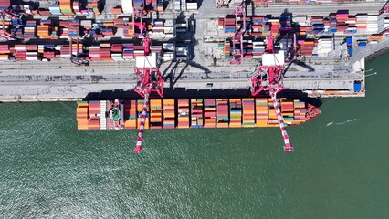 Port Of Lisbon In Lisbon Portugal. Breathtaking Aerial View Of Freight Ship Sailing Near The Port. Business Sky Background Downtown Cityscape. Backgrounds Panorama. Lisbon Portugal.