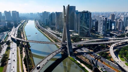 Fototapeta premium Cable Bridge In Downtown Sao Paulo Brazil. Cars Driving Towards Downtown City On The Famous Bridge. Town Clouds Sky Backgrounds Urban. Backgrounds Downtown Panoramic City. Downtown Sao Paulo.