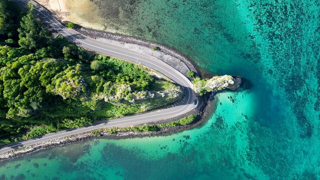 Coastal Road In Baie Du Cap Mauritius Island Mauritius. Breathtaking Aerial View Of Busy Traffic In A Freeway Road. Shore Sky Clouds Beach Sea. Outdoor Beach Panning Wide.