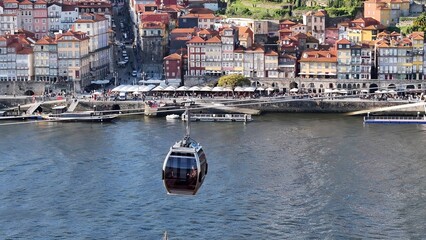 Obraz premium Cable Car In Porto Portugal. Amazing Landscape Of Aerial Cable Car Viewed From Above. Business Sky Downtown Cityscape. Business Backgrounds Panorama. Porto Portugal.