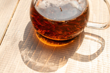 Glass Teapot with Tea and Shadow