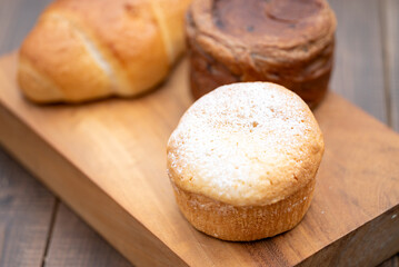Assorted Bread Loaves on Wooden Cutting Board