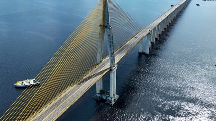 Suspension Cable Bridge In Manaus Amazonas Brazil. Bridge Showcasing The Traffic Flowing Across In...
