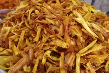 crunchy deep fried jackfruit chips in the background