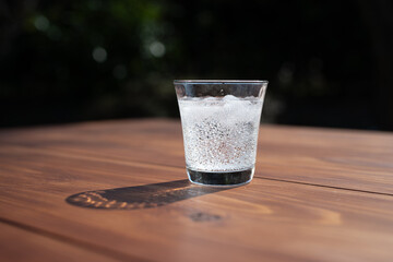 Sparkling Water with Ice on Wooden Table