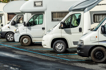 campers and motorhomes on asphatl parning, white auto caravan for  vacation travel