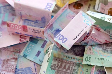 Big amount of different Ukrainian hryvnia money bills. Pile of crumpled ukrainian banknotes