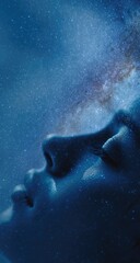 A profile view of a person's face, seemingly asleep, with a celestial, star-filled background blending seamlessly into the skin