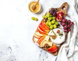 Assorted cheese and fruit platter on a wooden board