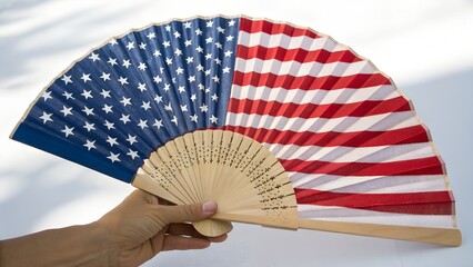 A hand fan featuring the American flag isolated on a transparent background