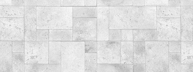 Fototapeta premium White stone wall tiles showing a seamless texture