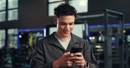 Smile, athlete and man with phone at gym for social media, fitness app and sign up on website. Happy, male person and mobile for research, review progress and online notification of sports membership - Powered by Adobe